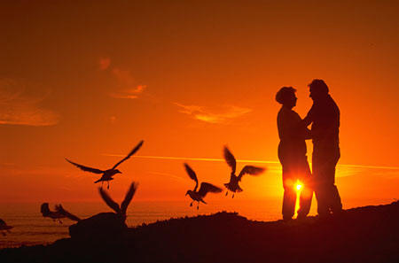 Couple at beach at sunset